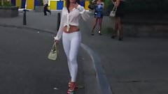 hooker walking in the street in sexy high heels and legging